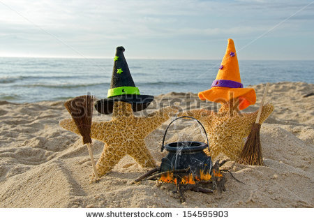 stock photo starfish on the beach with witch s hats and brooms 154595903