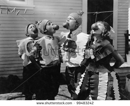 stock photo kids biting apples on strings at halloween 99483242