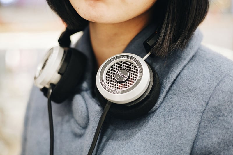 woman with headphones around her neck